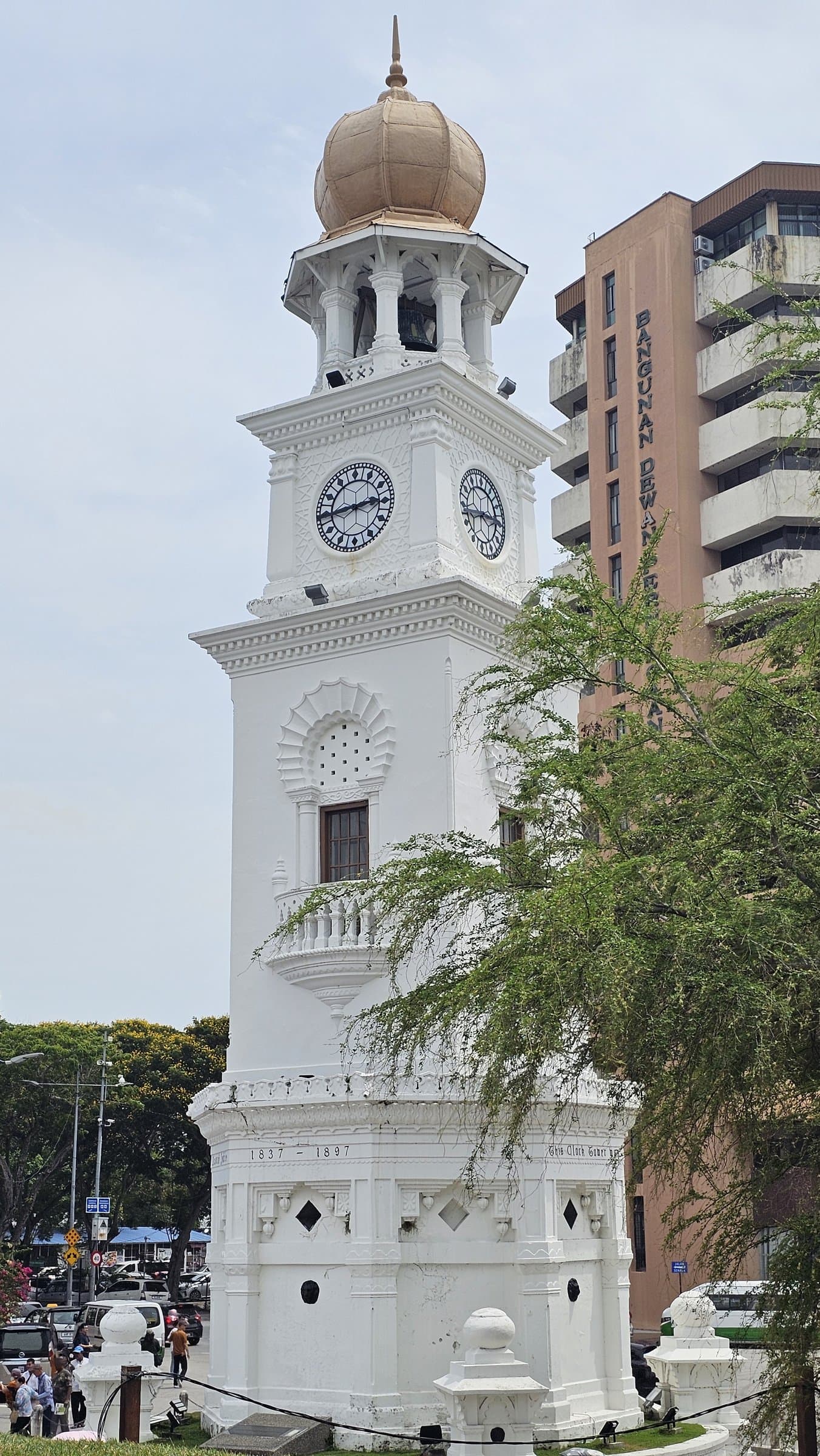 The white Queen Victoria Memorial Clock Tower on the Esplanade in George Town, Penang